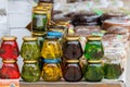 glass jars with favoured honey - with linden, herbs and pine needles, close-up Royalty Free Stock Photo