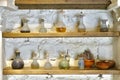 Glass jars and flasks of different colors and shapes in a very old pharmacy Royalty Free Stock Photo