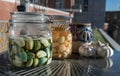 Glass jars with Garlic pickled in Apple cider vinegar with Rock sugar. Healthy pickled garlic