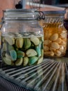 Glass jars with Garlic pickled in Apple cider vinegar with Rock sugar. Healthy pickled garlic