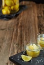 Glass jars with lemon pieces in salt