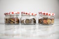 3 glass jars of loose cash and 2Ã¢âÂ¬ coins for housekeeping money, vacation or saving goals