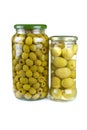 Glass jars with pitted and giant green olives Royalty Free Stock Photo