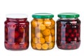 Glass jars with preserved apricots, cherries and plums Royalty Free Stock Photo