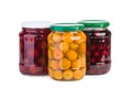 Glass jars with preserved cherries, plums and apricots Royalty Free Stock Photo