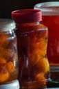 Glass jars with red lid with apple jam close-up. Home canning. Delicious dessert for tea. Cooking. Royalty Free Stock Photo