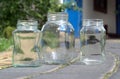 Glass jars stand on the walkway