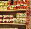 Glass jars with typical Calabrian food dried tomato peppers and Royalty Free Stock Photo