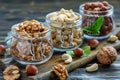Glass jars with walnuts, cashews and hazelnuts. Royalty Free Stock Photo