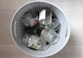 Glass jars in waste basket for recycling