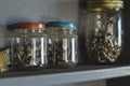 Glass jars on the wooden workshop shelf