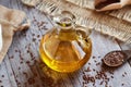 A glass jug of flax seed oil Royalty Free Stock Photo