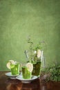 Glass jug with green tea Royalty Free Stock Photo