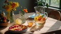 Glass jug with lemonade and fruits on wooden table at home.