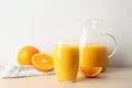 Glass and jug of orange juice and fresh fruits Royalty Free Stock Photo