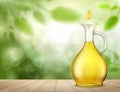 Glass jug with yellow oil and a drop on a wooden table