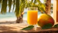 A glass juice drink mango on a background of sea and palm trees tropical table