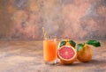 One glass of fresh grapefruit juice on a abstract background Royalty Free Stock Photo