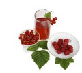 A glass with juice, a raspberry on a saucer and a Royalty Free Stock Photo