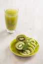 Glass of kiwi juice with fresh fruits on wooden table Royalty Free Stock Photo