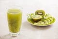 Glass of kiwi juice with fresh fruits on table Royalty Free Stock Photo