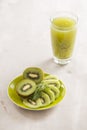 Glass of kiwi juice with fresh fruits on wooden table Royalty Free Stock Photo