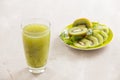 Glass of kiwi juice with fresh fruits on wooden table Royalty Free Stock Photo