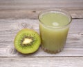 Glass of kiwi juice with fresh fruits Royalty Free Stock Photo