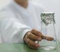 Glass lab beaker and foil Royalty Free Stock Photo