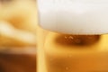 Glass of lager beer closeup on wooden table Royalty Free Stock Photo