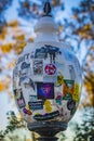 The glass lamp on the street of Barcelona is pasted with advertising posters