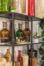 Glass large empty bottles and flasks, for wine and alcoholic beverages on a shelf in a shop window are sold on a shelf Royalty Free Stock Photo