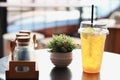 Glass of lemon tea with ice on table in coffee shop Royalty Free Stock Photo