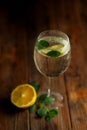 A glass of lemonade on the background with a wooden texture Royalty Free Stock Photo