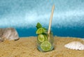 A glass of lemonade on the beach Royalty Free Stock Photo