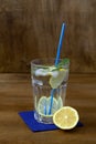 Glass of lemonade with lemon and fresh leafs mint. homemade cold refreshing drink Royalty Free Stock Photo
