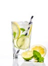 Glass of lemonade with lemon, lime and mint on white background Royalty Free Stock Photo