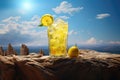 Glass of lemonade on the top of rocks in sunset Royalty Free Stock Photo