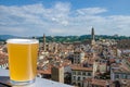 Glass of light beer against view from above of Florence historic city center in Italy Royalty Free Stock Photo