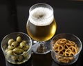 Glass of light beer on black reflective background Royalty Free Stock Photo