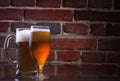 Glass of light beer on a dark pub. Royalty Free Stock Photo