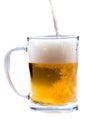 Glass of light beer pouring from bottle on a white background Royalty Free Stock Photo