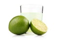Glass of lime juice and lime fruits isolated Royalty Free Stock Photo