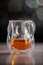 A glass of liquor is sitting on a table Royalty Free Stock Photo