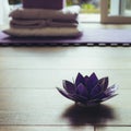 Glass lotus decorative on a woodn floor. Yoga concept Royalty Free Stock Photo