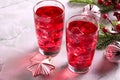 Glass of mango dragonfruit refresher drink on marble table with ice cubes. Copy space Royalty Free Stock Photo