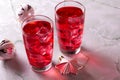 Glass of mango dragonfruit refresher drink on marble table with ice cubes. Copy space Royalty Free Stock Photo