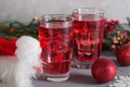 Glass of mango dragonfruit refresher drink on table with ice cubes. Copy space Royalty Free Stock Photo