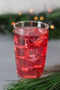 Glass of mango dragonfruit refresher drink on table with ice cubes. Copy space Royalty Free Stock Photo