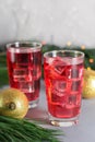 Glass of mango dragonfruit refresher drink on table with ice cubes. Copy space Royalty Free Stock Photo